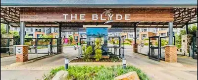 a gas station with a sign that reads the bicycle at SoulSerene Inn in Pretoria