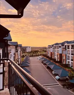 a view from a balcony of a parking lot at SoulSerene Inn in Pretoria