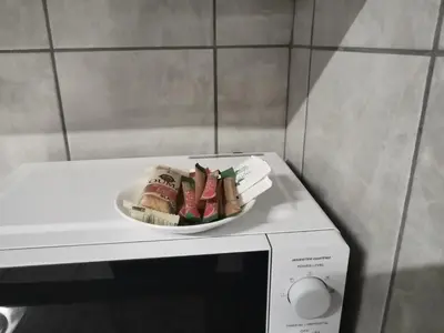 a plate of food sitting on top of a microwave at Capital Park entire rental unit in Pretoria