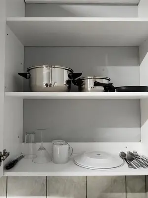 a kitchen with two pots and pans on a shelf at Capital Park entire rental unit in Pretoria