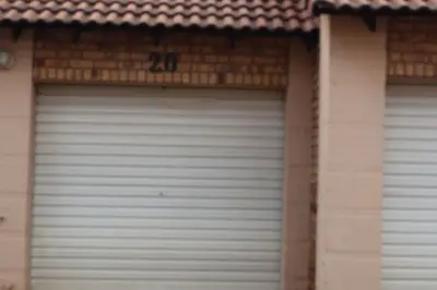 a pair of garage doors in a building at Lovely Home away from Home in Centurion