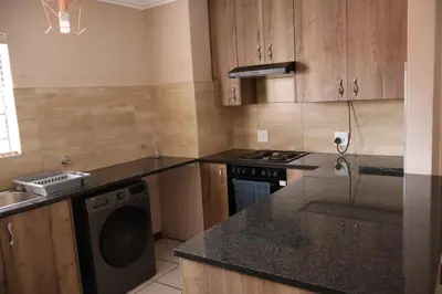 a kitchen with a stove and a dishwasher at Lovely Home away from Home in Centurion