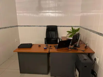 a desk with two laptop computers on top of it at Berry Home 4U in Pretoria