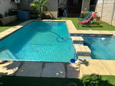 a swimming pool with a ball in the water at Berry Home 4U in Pretoria