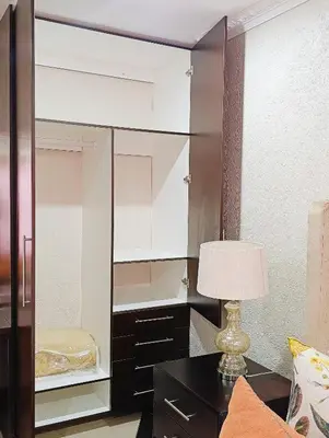 a large mirror in a room with a lamp on a table at Elephant Villa in Nelspruit