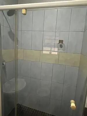 a shower in a bathroom with a glass door at Entire rental unit in Pretoria