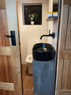 a bathroom with a sink and a toilet at Executive loft at Brooklyn in Pretoria