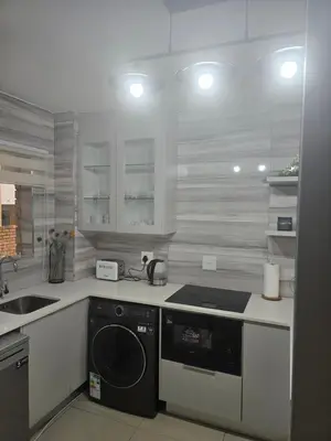 a kitchen with a stove and a dishwasher at Ikar's Haven in Centurion
