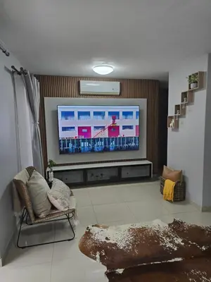 a living room with a large flat screen tv at Ikar's Haven in Centurion