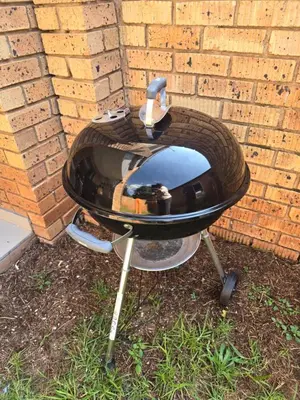 a bbq grill in front of a brick wall at Ikar's Haven in Centurion