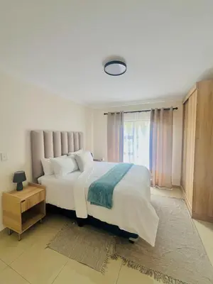 a bedroom with a large bed and a window at U4 KT View in Midrand