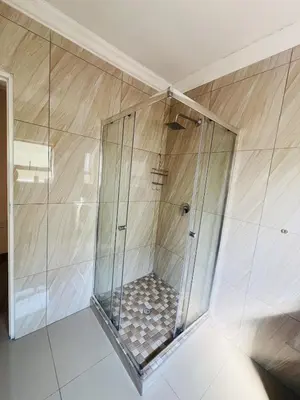 a shower with a glass enclosure in a room at U4 KT View in Midrand