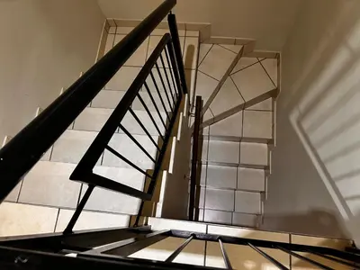a spiral staircase with a stair case in a building at Castle in the Capital City 3-Beds in Pretoria