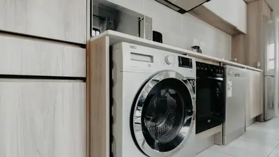 a washer and dryer in a laundry room at The Blyde Crystal Lagoon Apartment in Pretoria