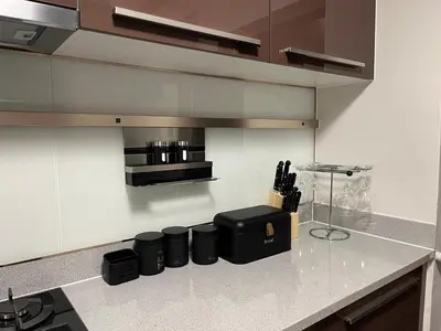 a kitchen with a counter with knives and a stove at Ambience Defined in Randjesfontein