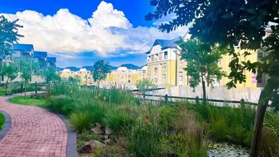 a brick walkway in front of a yellow building at Family Elegant Smart Home in Midrand