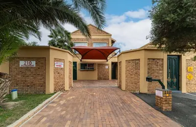 a house with a brick walkway in front of it at 210 Guest in Kempton Park