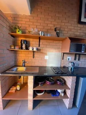 a kitchen with a sink and a counter top at Mordern Lil' Love Nest Loft in Midrand in Midrand