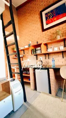 a kitchen with a staircase and a kitchen with a refrigerator at Mordern Lil' Love Nest Loft in Midrand in Midrand