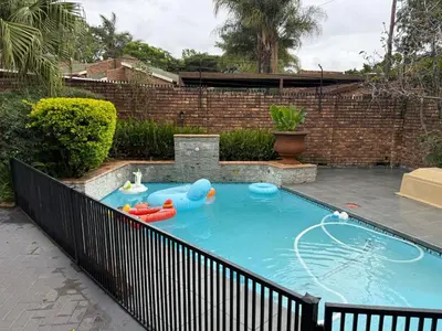a backyard pool with an inflatable pool with a pool noodle pool at JuaMtoto guesthouse in Pretoria