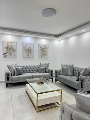 a living room with couches and a coffee table at Zaidi Luxury Home in Secunda