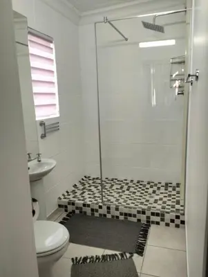 a bathroom with a shower and a toilet at 20 on Middle in Polokwane