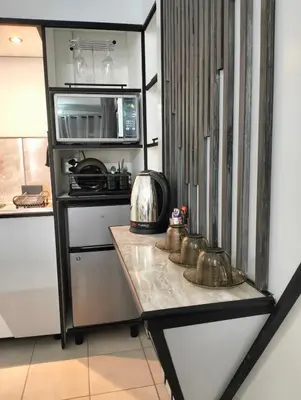 a kitchen with a counter with a microwave and a stove at 20 on Middle in Polokwane