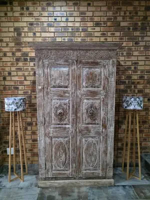 an old wooden door in front of a brick wall at Rocky Mountain Holiday Home in Hartbeespoort