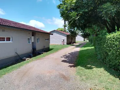 a dirt road in front of a house at Panorama home 19 in Graskop