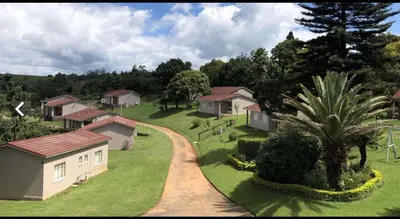 an aerial view of a village with houses and a road at Panorama home 19 in Graskop