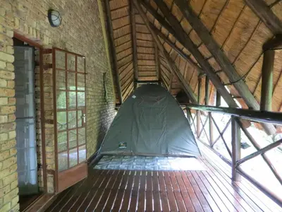 a tent in the middle of a building at Rafikis Safari at Kruger in Marloth Park