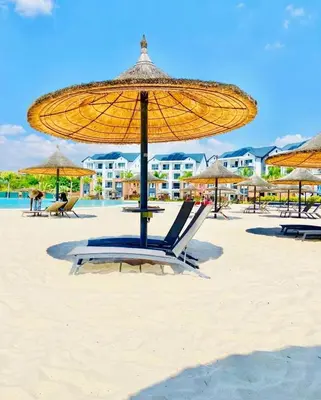 a beach with a chair and an umbrella on the sand at Views at The Blyde in Pretoria
