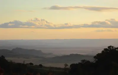 a view of a valley with clouds in the sky at Kwaggaskop Game Farm - near Dullstroom in Belfast