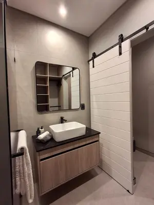 a bathroom with a sink and a mirror at King size bed-NO loadshedding-Free Wi-Fi in Pretoria