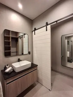 a bathroom with a sink and a mirror at King size bed-NO loadshedding-Free Wi-Fi in Pretoria