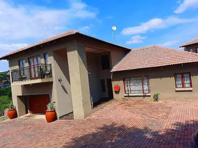 a house with a red tile roof at Elephant Villa Private Room in Nelspruit