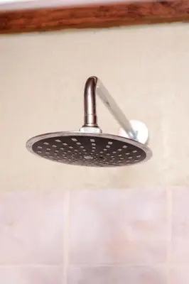 a shower head hanging from the ceiling in a bathroom at Ukhanya resort in Midrand