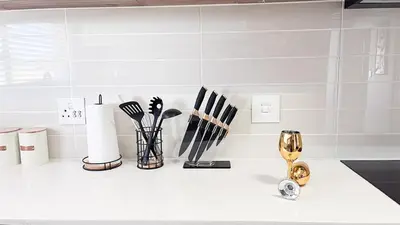 a kitchen counter with utensils on a white counter top at Smart Home Oasis & Luxury Living in Midrand