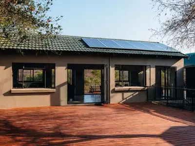 a house with solar panels on the roof at Meulensrus in Hoedspruit