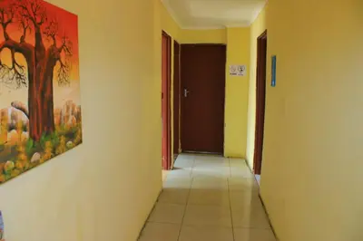 a hallway with a painting on the wall at Baroka Overnight Accommodation in Polokwane