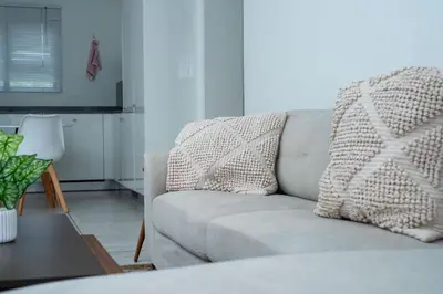 a living room with a couch and a table at Feelathome in Midrand