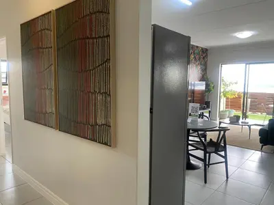 a room with a table and a painting on a wall at Big deana home in Pretoria