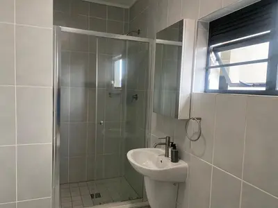 a bathroom with a shower and a sink at Big deana home in Pretoria