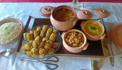 a table with a tray of food and bowls of food at Green Haven in Benoni