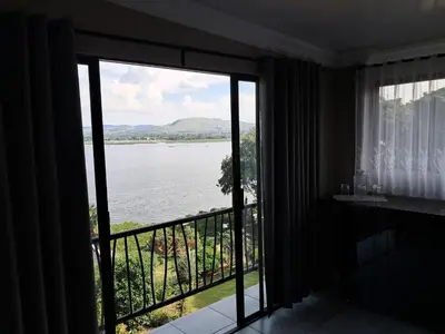 a room with a view of the water at THE GALLARY INN, Kosmos, Hartbeespoort in Hartbeespoort