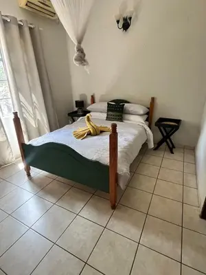 a bedroom with a bed with bananas on it at Hello Kruger Hideaway in Marloth Park