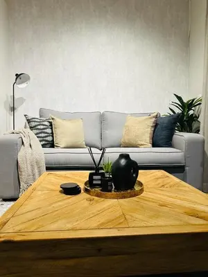 a living room with a coffee table and a couch at Riamus Luxury Apartment in Midrand