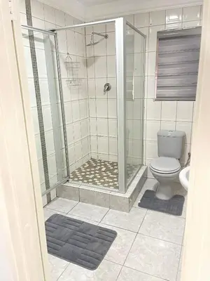 a bathroom with a shower and a toilet at Beautiful Customized Hide Out in Centurion