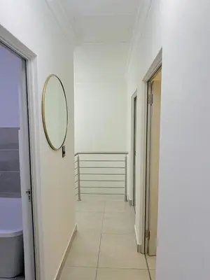 a hallway with a mirror on the wall at HMT Modern House in Centurion
