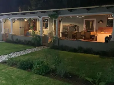 a house with a backyard at night at Villa 21 in Pretoria